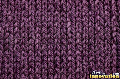 Deep burgundy waffle knit with square pockets under even light