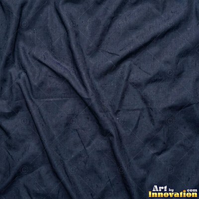 Crinkled charcoal gray silk with fine pleats across the frame