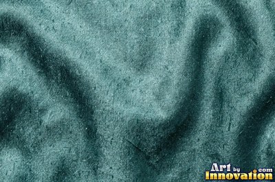 Emerald silk with gentle folds catching soft front light