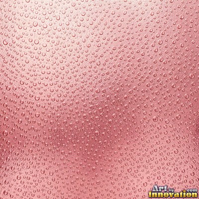 Hammered glass covered in small dimples with a rose pink tint
