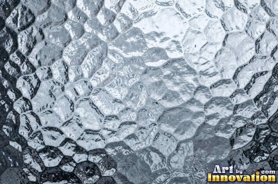 Patterned glass with a floral relief in smoky gray
