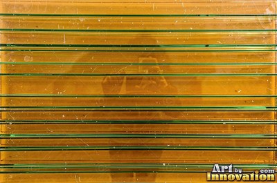 Patterned glass with a floral relief in smoky gray