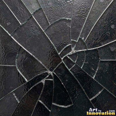 Cracked glass with light catching the fracture edges