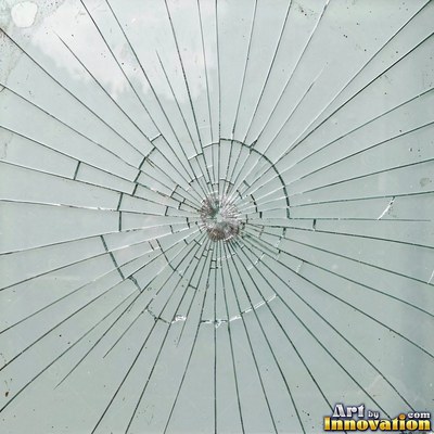 Shattered glass with a spider web of cracks in violet tones