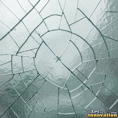 Laminated glass with a web of cracks held together, faint blue tint
