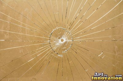 Smoky gray cracked glass laid over a dark background