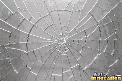 Smoky gray cracked glass laid over a dark background