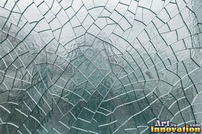 Shattered glass with a spider web of cracks in violet tones