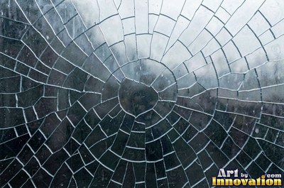 Shattered glass with a spider web of cracks in violet tones