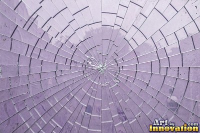 Laminated glass with a web of cracks held together, faint blue tint