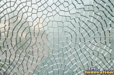 Smoky gray cracked glass laid over a dark background