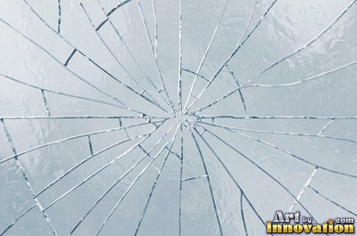 Cracked glass with light catching the fracture edges