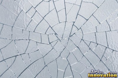Smoky gray cracked glass laid over a dark background