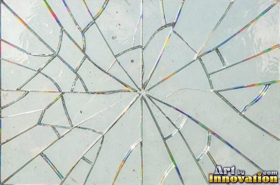 Cracked glass with light catching the fracture edges