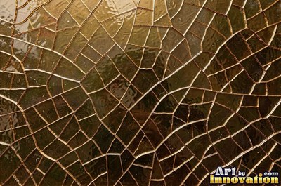Smoky gray cracked glass laid over a dark background