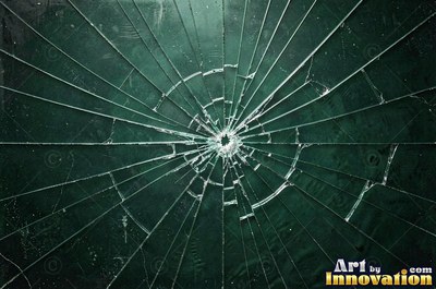 Laminated glass with a web of cracks held together, faint blue tint