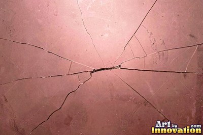 Smoky gray cracked glass laid over a dark background