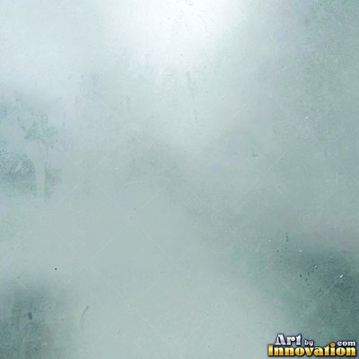 Frosted glass with soft emerald bokeh lights behind it