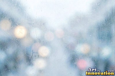 Frosted glass with soft emerald bokeh lights behind it
