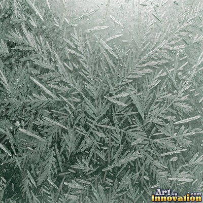 Frosted surface covered in fine crystal needles of pale aqua