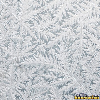 Frosted surface covered in fine crystal needles of pale aqua