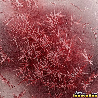 Cracked lake ice with white fracture lines and a honey gold glow