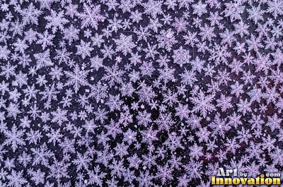 Frosted surface covered in fine crystal needles of pale aqua