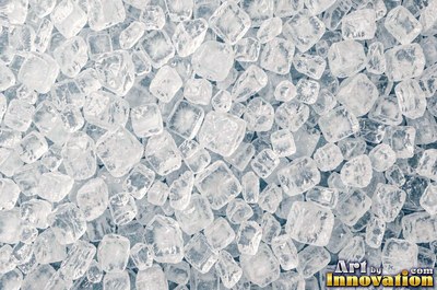 Snowflakes resting on dark sea green ice