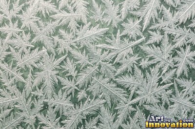 Clear ice full of trapped air bubbles in icy white blue