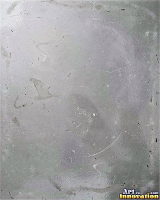 Iridescent glass bubbles packed together in icy blue