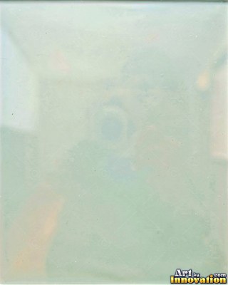 Iridescent glass bubbles packed together in icy blue