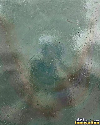 Iridescent glass bubbles packed together in icy blue