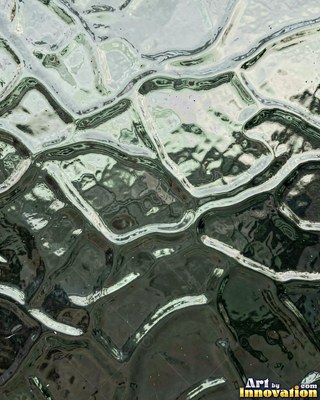 Iridescent glass bubbles packed together in icy blue