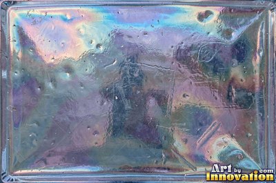 Iridescent glass bubbles packed together in icy blue