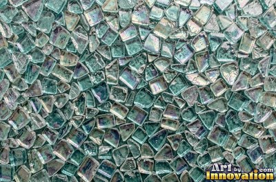 Iridescent glass bubbles packed together in icy blue