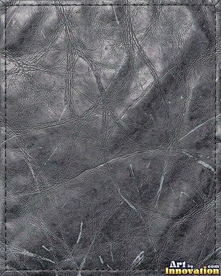 Burgundy leather marked with water stains and dark spots