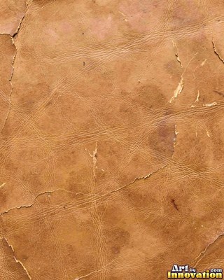 Worn saddle tan leather scuffed pale along the creases