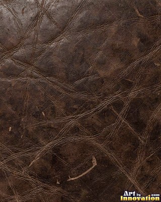 Burgundy leather marked with water stains and dark spots