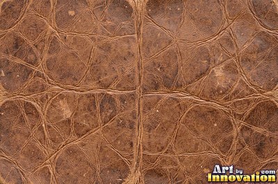 Old cracked leather with a crazed surface in whiskey brown