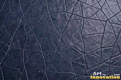 Old cracked leather with a crazed surface in whiskey brown
