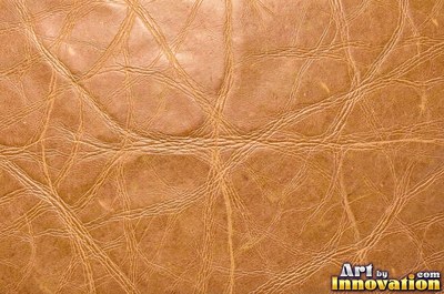 Old cracked leather with a crazed surface in whiskey brown