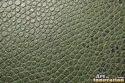 Ostrich embossed leather with raised quill bumps in saddle tan