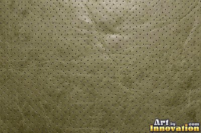 Ostrich embossed leather with raised quill bumps in saddle tan