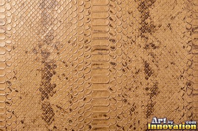 Ostrich embossed leather with raised quill bumps in saddle tan