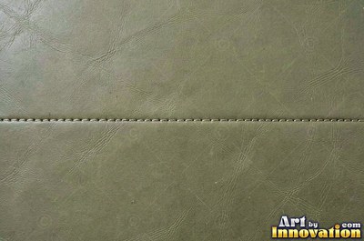 Waxed forest green leather with a faint pull up effect