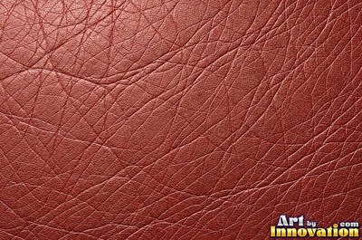 Smooth saddle tan leather panels joined at a seam