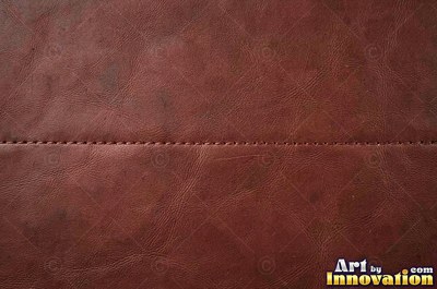 Smooth saddle tan leather panels joined at a seam