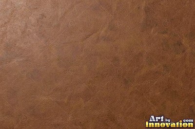 Smooth saddle tan leather panels joined at a seam