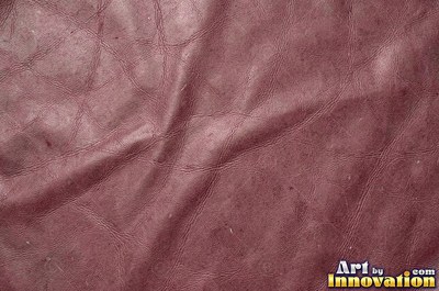 Smooth saddle tan leather panels joined at a seam
