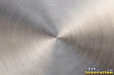 Brushed metal sheet with fine straight lines in cool blued steel